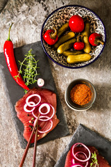 tuna steaks on a kitchen board with pepper