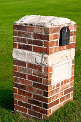 Residential brick and stone mailbox.