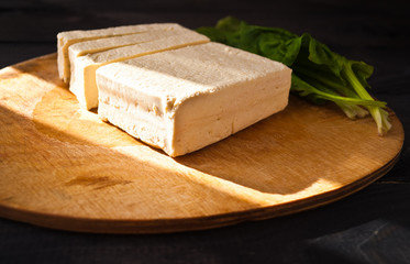 Slices of raw tofu and spinach