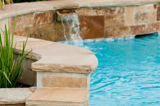 Luxurious Swimming Pool With Stone Waterfall.