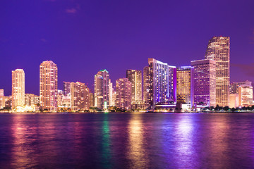 Fototapeta na wymiar Beautiful night scene skyline of Miami Florida with lights and water