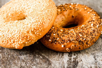 Fresh bagel on a stone background