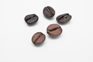 three coffee beans isolated on white background