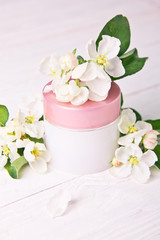 Fototapeta na wymiar Natural facial cream with apple blossom
