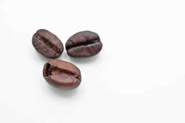 three coffee beans isolated on white background