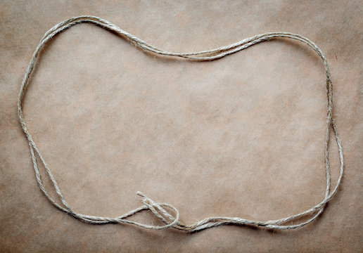 Frame Of Twine On A Background At Kraft Paper