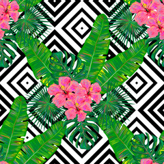 Seamless summer pattern with exotic tropical hibiskus flower and palm leaves vector background. Perfect for wallpapers, pattern fills, web page backgrounds, surface textures, textile © Katsiaryna Hatsak