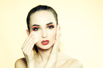 Young girl removing makeup