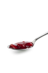 a spoon scoop on strawberry jam