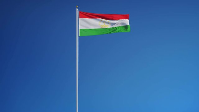 Tajikistan flag waving in slow motion against clean blue sky, seamlessly looped, long shot, isolated on alpha channel with black and white luminance matte, perfect for film, news, digital composition