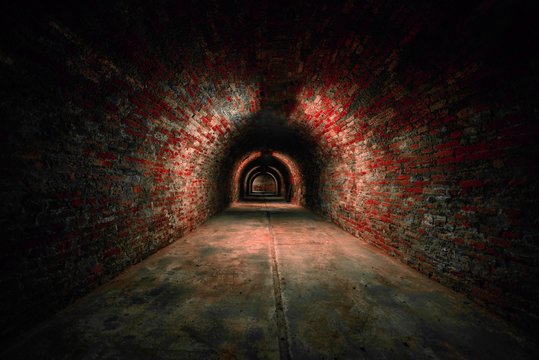 Fototapeta Long underground brick tunnel angle shot
