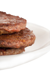a plate of juicy beef patties