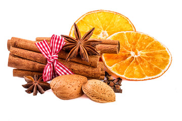 Christmas spices cinnamon, anise, clove, almond nuts and dried orange slices.