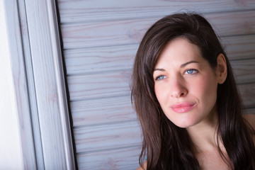 Portrait of beautiful young brunette woman outside