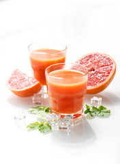Fresh healthy grapefruit juice fruits mint leaves