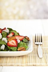 cropped plate of spinach salad
