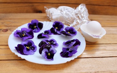 Candied Pansies in the glaze of egg whites with powdered sugar