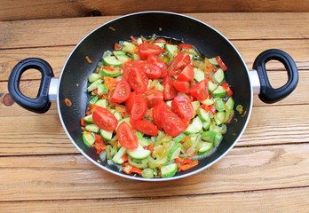 Vegetables stewed fried in oil in a frying pan