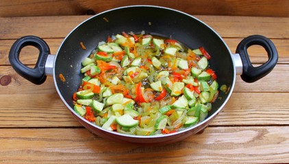 Vegetables stewed fried in oil in a frying pan