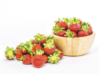 fresh whole strawberries in wooden bowl