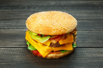 Meet and cheese burger at rustic wood
