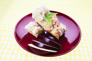 apple pie served in red plate.