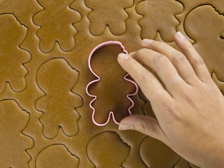 close-up of woman's hand preparing christmas cookies