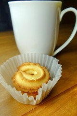 Butter cookies on a wood background.