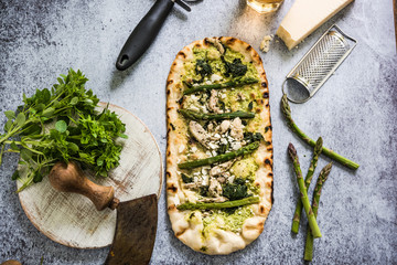 Homemade artisan pizza with asparagus