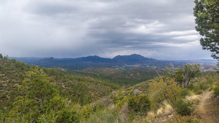 Naklejka premium AZ-Prescott-Circle Trail(Ranch Trail - Turley Trail). This trail is filled with spectacular views of Granite Mountain and Thumb Butte.The impending storm made our hike even more exciting!