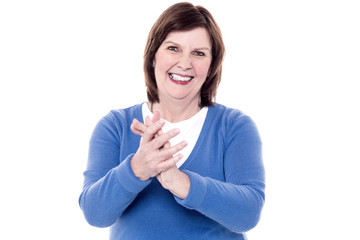 Portrait of happy applauding senior woman