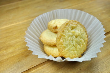 Butter cookies on a wood background.