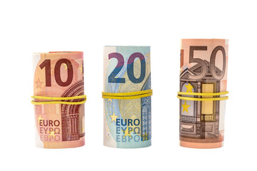 Ten, twenty and fifty euro rolled up. Isolated on white