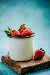 vintage jat with fresh strawberries