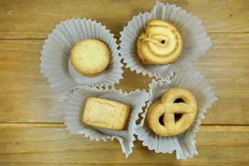 Butter cookies on a wood background.