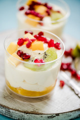 Tropical mousse dessert with pomegranate