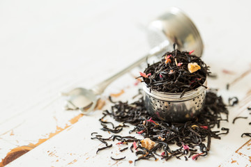Dry black tea in infuser