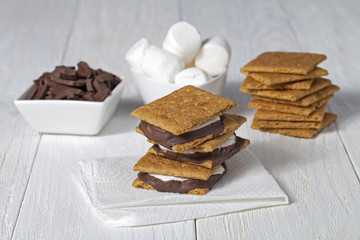 smore sandwich with other ingredient in background.