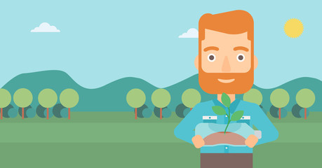 Man with plant growing in bottle.