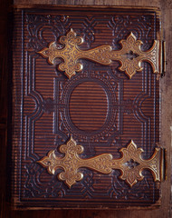 top view of antique book cover, with brass clasps