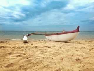 outrigger canoe on the beach