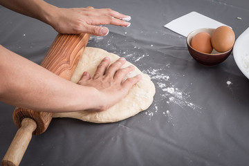 Female hands baking dough