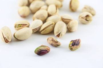 Pistachois nuts on white background.