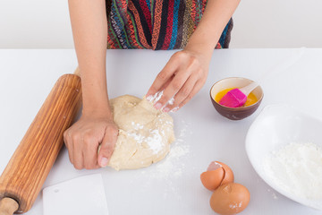 Female hands baking dough