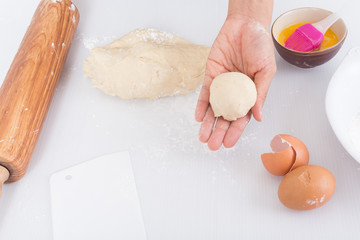 Female hands baking dough