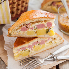 Two Pieces of Potato, Ham, Sour Cream and Cheese Pie