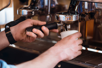 Professional  barista making coffee