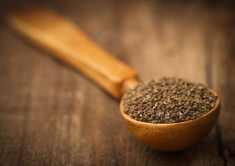 Ajwain seeds in a wooden spoon