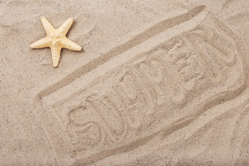Fototapeta na wymiar Inscription summer on beach sand with starfish