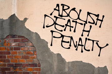 Handwritten graffiti Abolish Death Penalty sprayed on the wall, anarchist aesthetics. Appeal to stop capital punishment and executions on defendants